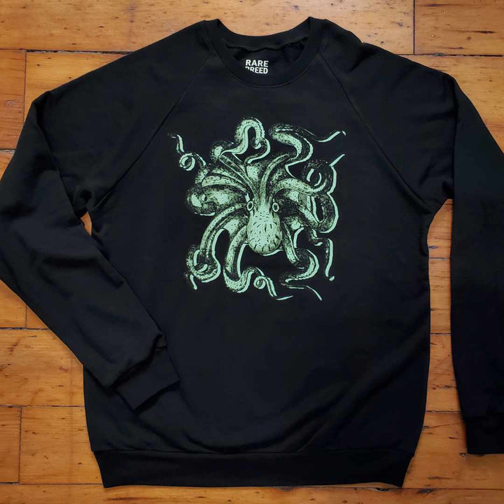 Rare Breed Organic Apparel's Octopus Sweatshirt is made of luxurious 100% Organic Cotton.  Designed in Canada and ethically manufactured in the USA (New York State).  This sweatshirt features a mint green octopus from a historical illustration on a night black crewneck sweatshirt.