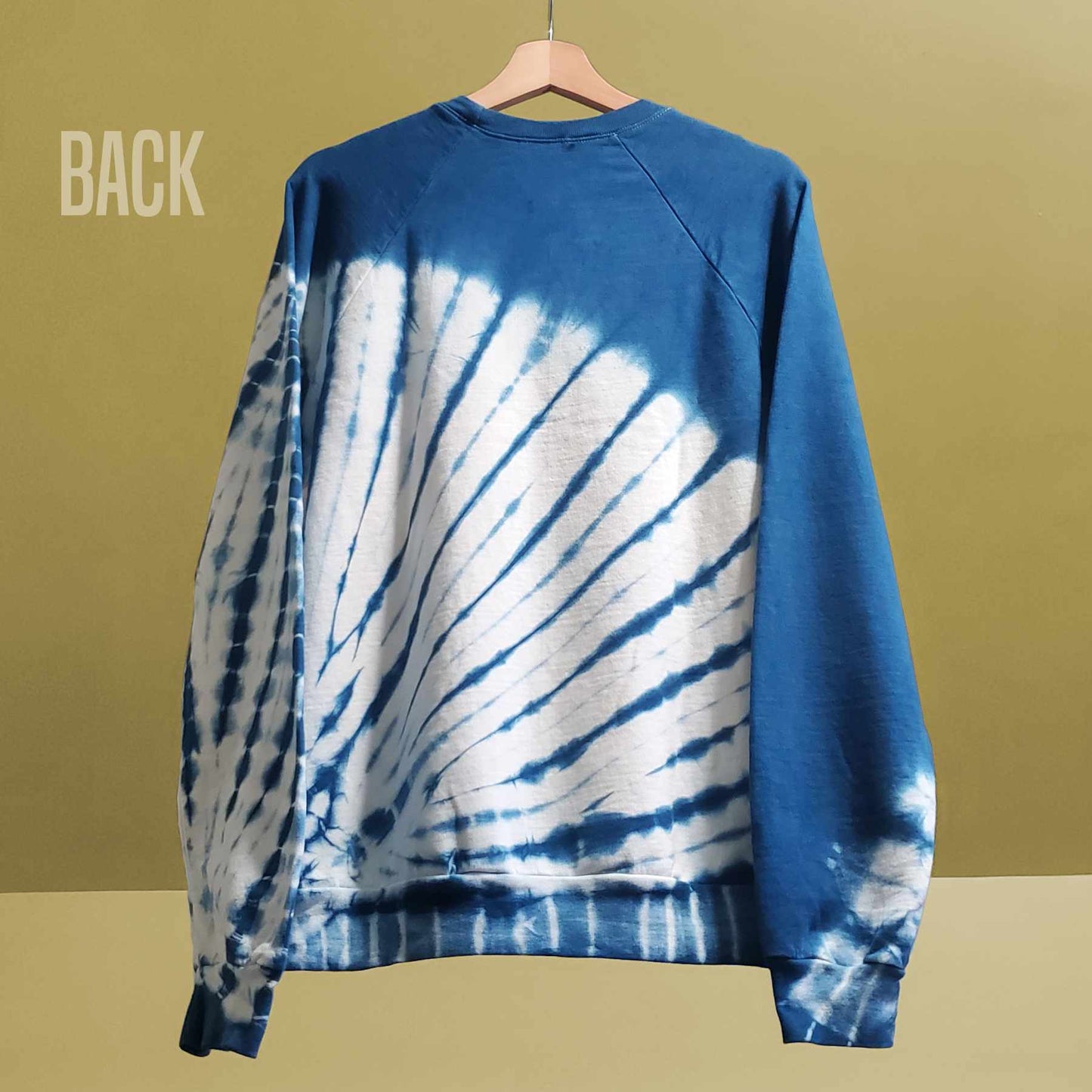 Indigo plant dyes were used to create a starburst pattern on this organic cotton tie-dyed sweatshirt by Rare Breed Organic Apparel.