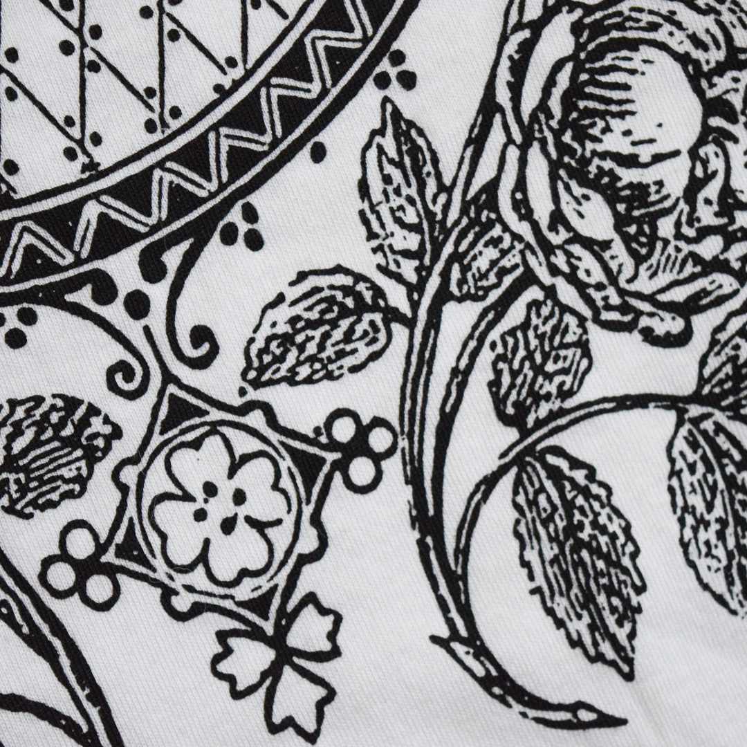 Close-up of screen-printed organic T-shirt with roses.