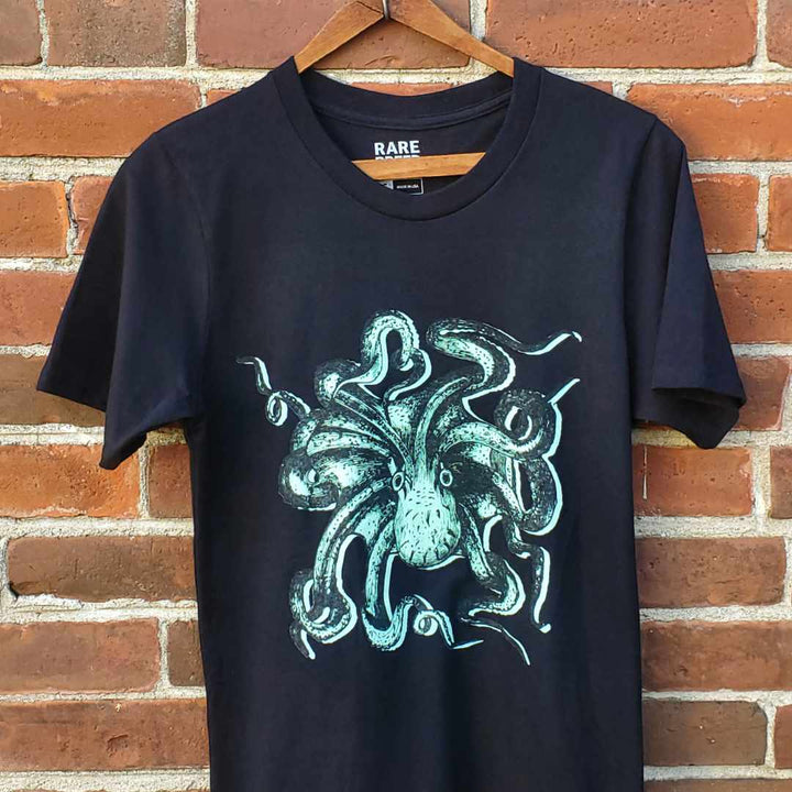 This Octopus T-shirt by Rare Breed features a vintage "devil fish" illustration, screen printed in black and teal on a 100% organic cotton T-shirt. Designed in Canada and ethically manufactured in the USA.