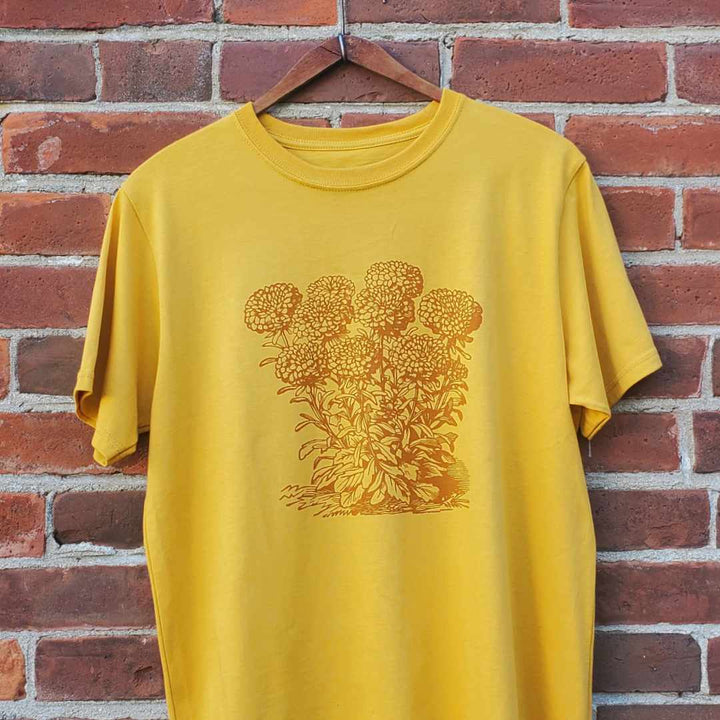 Rare Breed Organic Apparel's mustard yellow organic T-shirt featuring a vintage marigold design. Responsibly made in North America using organic cotton. Available for shipping through the United States and Canada.