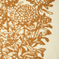 Close up of Rare Breed Organic Apparel's Marigold women's T-shirt.  The closeup shows rust marigolds screen printed on a cream-coloured 100% organic cotton T-shirt.